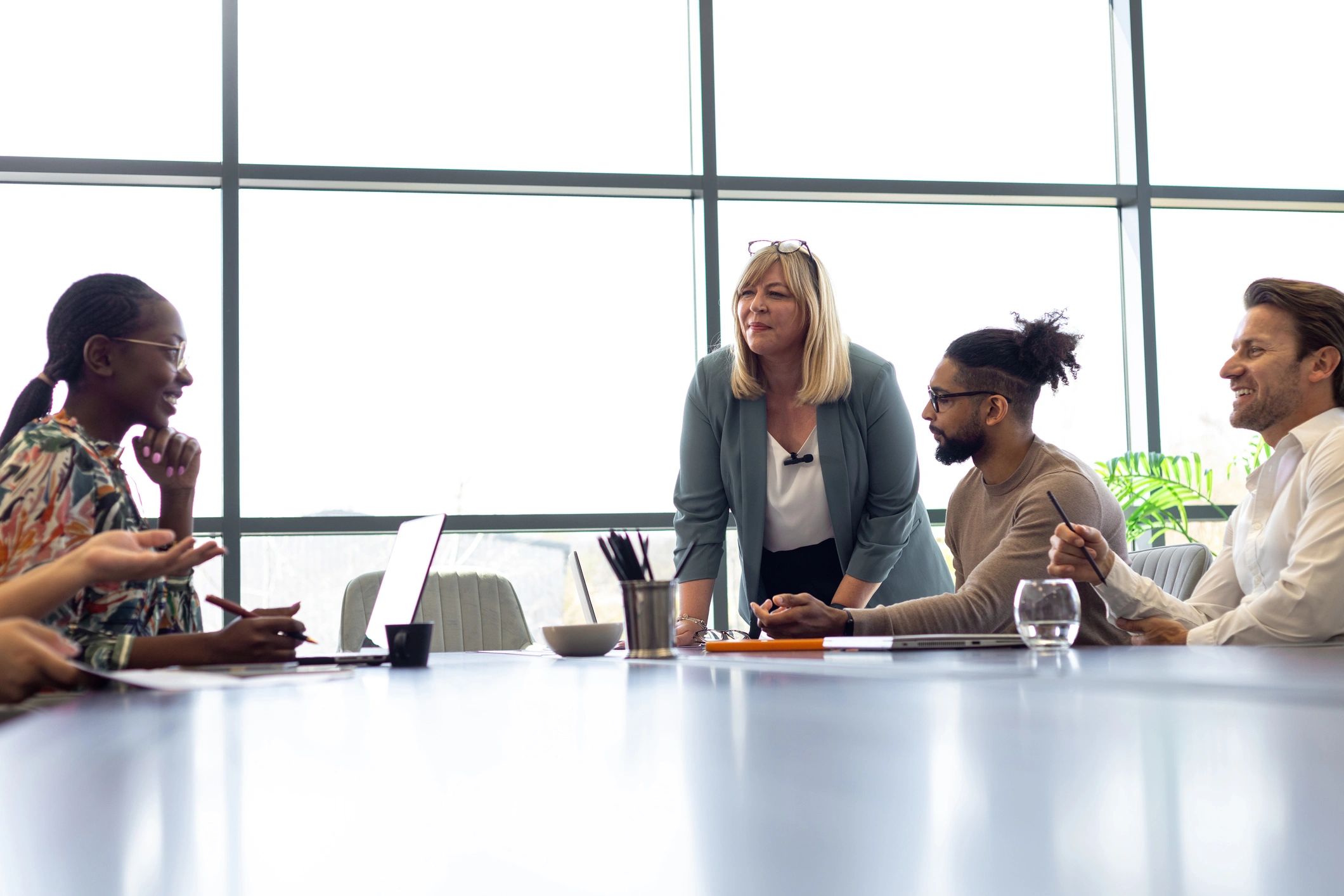 Collaborative technology team discussing product strategy in a modern office